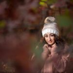 a girl in a cap posing