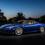 Light painting photograph of blue Ferrari 350 super car