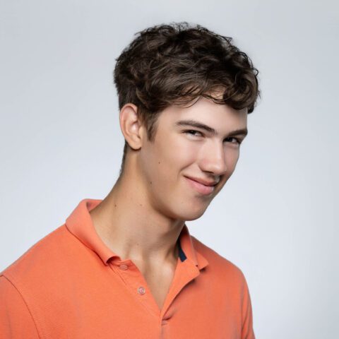 untitled-0000-5-2 Young adult male actor headshot against grey background